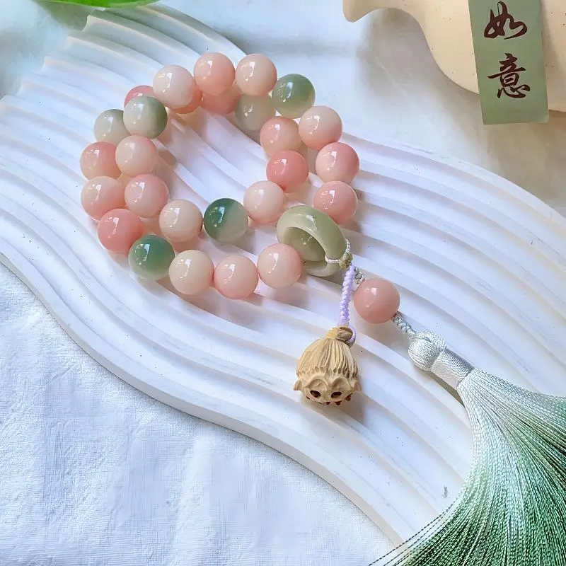 Vòng tay bồ đề Bạch Ngọc hồng phối xanh – hoa sen, tua rua (VB06)